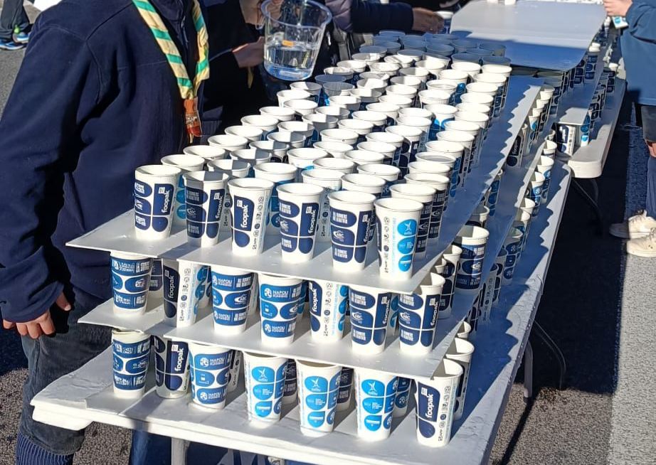 Hydration station in action as Foopak paper cups are prepared for runners.